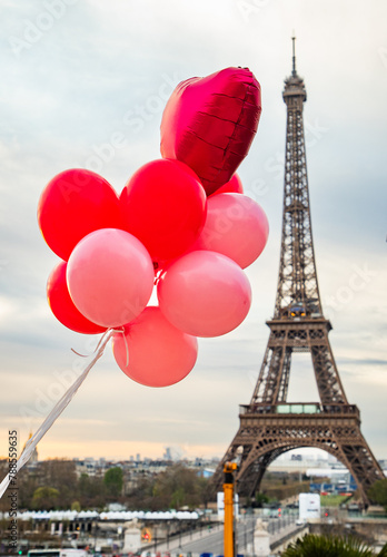 pink and red balloons in front of Eiffel tower  Paris  city of love
