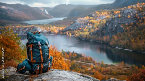 beautiful TRAVEL backpack ON A STONE and a beautiful landscape of a lake photo