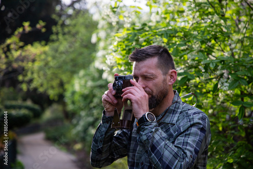 handsome man tourist with camera in Paris