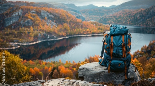 beautiful TRAVEL backpack ON A STONE and a beautiful landscape of a lake surrounded by mountains in autumn in high resolution and high quality. concept backpacks, resources, landscape, lake, autumn