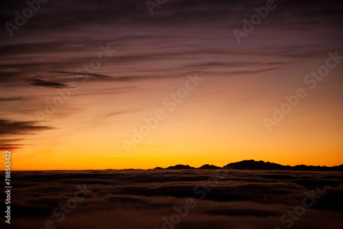 Spectacular sunset over a sea of clouds © elleonzebon