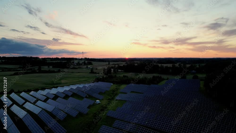 Drone footage of a solar power plant at sunset solar farm with ...