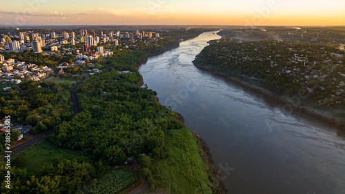 Border between Brazil and Paraguay and connects Foz do Iguaçu to Ciudad del Este. Ponte da Amizade in Foz do Iguaçu. Aerial view of the Friendship Bridge with Paraná river.. © marabelo