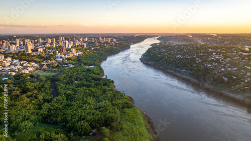 Border between Brazil and Paraguay and connects Foz do Iguaçu to Ciudad del Este. Ponte da Amizade in Foz do Iguaçu. Aerial view of the Friendship Bridge with Paraná river..