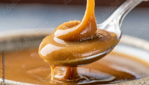 Dulce de leche in a spoon. Macro.
 photo