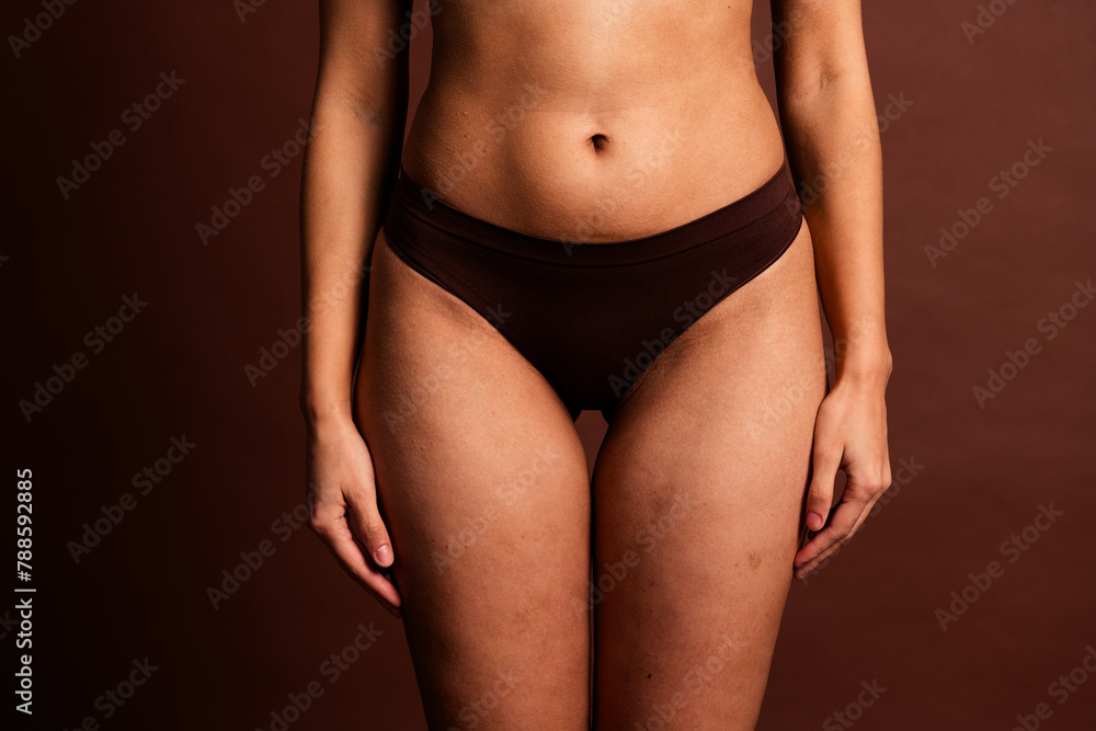 Cropped photo of plus size lady underwear lingerie comfortable panties isolated brown color background