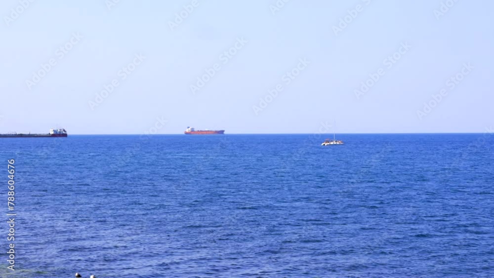 Witness the graceful movement of bulk carriers on the sea horizon. Serene and majestic, this footage captures the essence of tranquil ocean scenes. Perfect for nautical lovers seeking peaceful views. Witness the graceful movement of bulk carriers on the sea horizon. Serene and majestic, this footage captures the essence of tranquil ocean scenes. Perfect for nautical lovers seeking peaceful views.