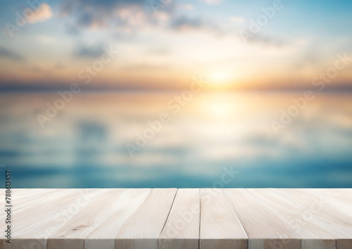 Wood table top on blur sparkling sea water and summer sky background morning