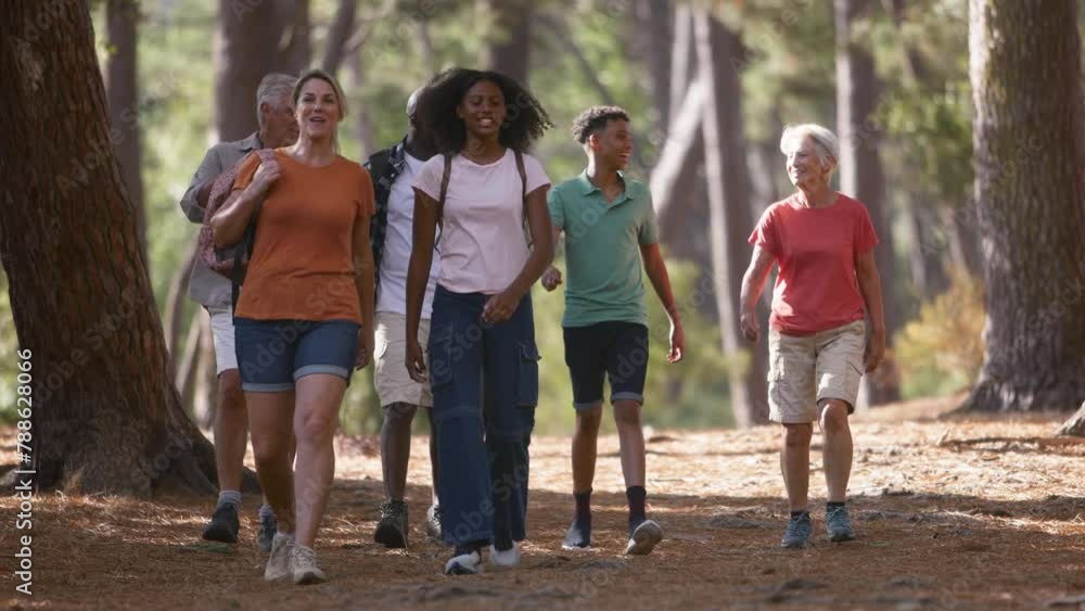 Active three generation family with teenage children on hike in countryside together- shot in slow motion Active three generation family with teenage children on hike in countryside together- shot in slow motion