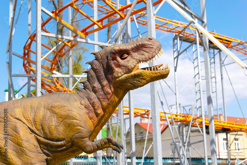 A large dinosaur statue attraction in park