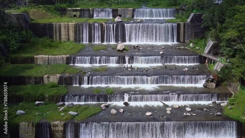 Aerial footage of the Watu Purbo Sabo Dam in Sleman, Indonesia which has a 6-level water dam. Apart from preventing the eruption of Mount Merapi, this dam is also a popular tourist destination photo