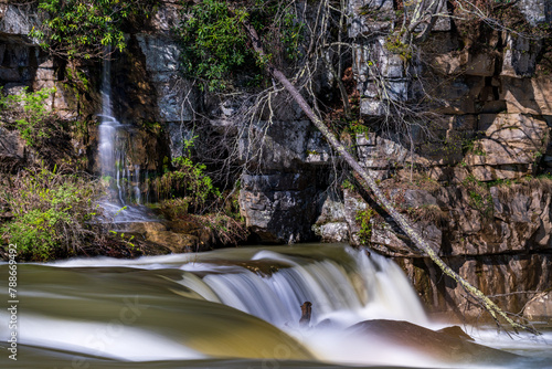 Small waterfall cascade on rocks by Valley Falls State Park near Fairmont in West Virginia on a colorful and bright spring day photo