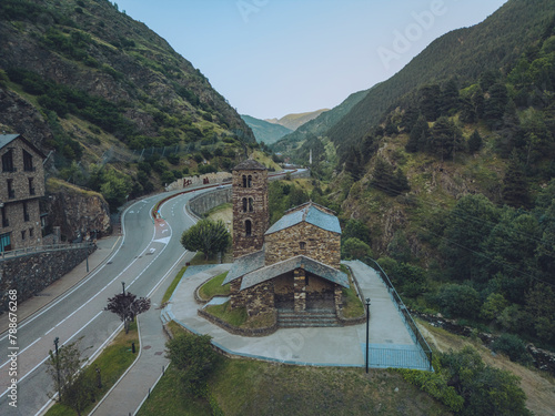 Aerial view of winding valley with meandering shapes and mountain summit, Sant Joan de Caselles Church, Canillo, Andorra. photo