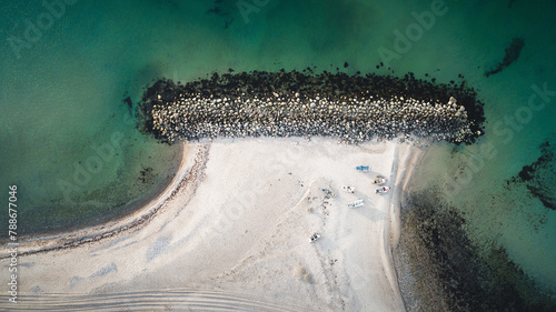 Aerial view of clear turquoise sea with boats and beach, Tisvilde, Zealand, Denmark.