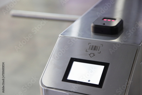 Infrared Barcode pass scanner on checkpoint turnstile closeup