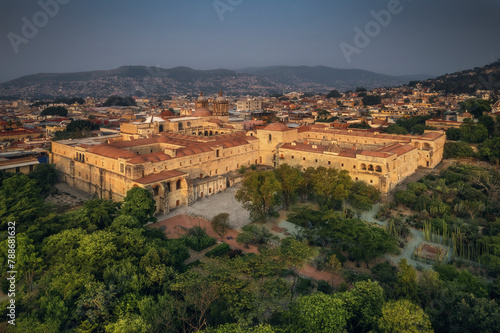 Aerial drone view of Santo Domingo church, an important landmark and botanic garden in Oaxaca at sunrise, Mexico. photo