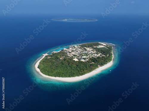 Aerial view of turquoise waters and sandy beaches in Muraidhoo, Haa Dhaalu Atoll, Maldives. photo