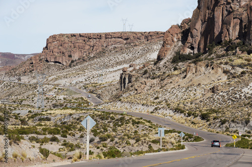 Passenger cars crossing desert area through route 5 in Bolivia