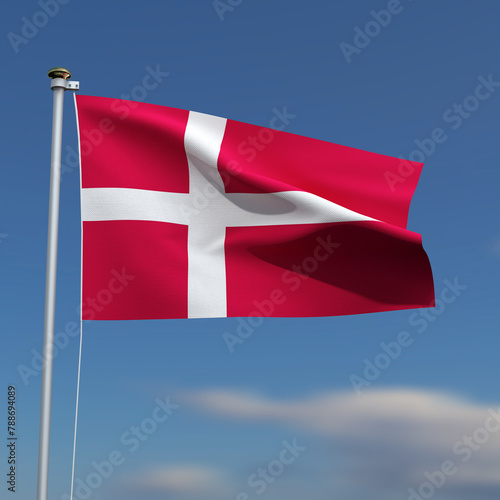 Denmark Flag is waving in front of a blue sky with blurred clouds in the background
