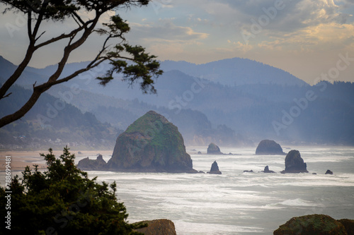 View of Haystack Rock from Ecola State Park. Known for some of the best views on the Oregon Coast and Haystack Rock, Ecola State Park is an ideal spot to watch enormous storm waves roll in. photo