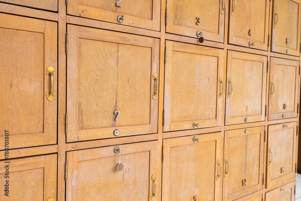 Wooden lockers in a locker room in the modern building, Locker room interior in modern fitness gym, free text space and empty room. Wooden lockers in a locker room in the modern building, Locker room interior in modern fitness gym, free text space and empty room.