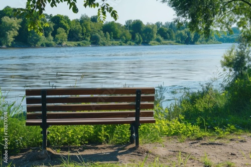 Bench on the bank of the river in summer day © darshika