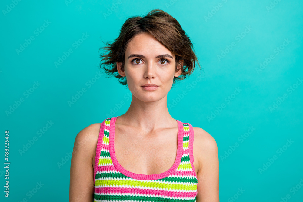 Portrait of amazing beautiful lady looking on camera daily makeup wearing striped singlet isolated blue teal color background Portrait of amazing beautiful lady looking on camera daily makeup wearing striped singlet isolated blue teal color background