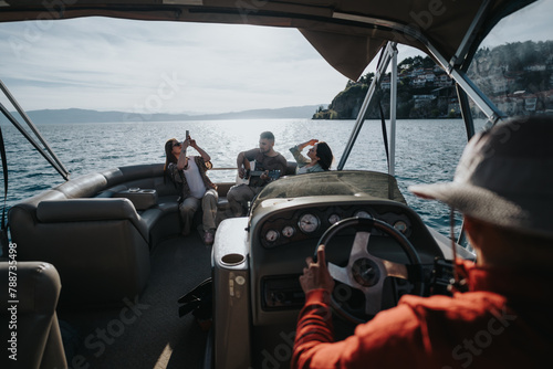 Group of friends on a boat enjoying drinks and taking photos on a clear sunny day with scenic water views. A perfect leisure time capturing moments.