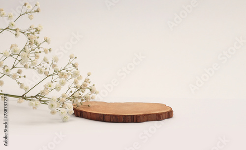 Flower, Wood stump platform podium on light beige background. Minimal empty display product presentation scene.
