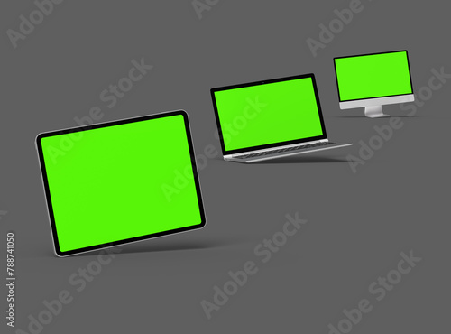 3d render of desktop, laptop and tablet with green screen on a dark background