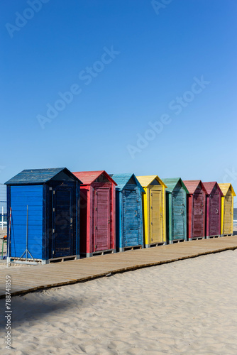 colorful huts at the beach © elias
