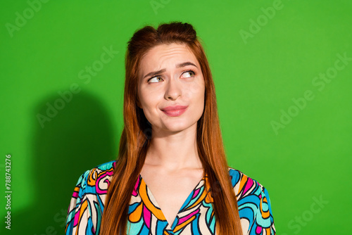 Photo portrait of attractive young woman look empty space dressed stylish retro clothes isolated on green color background