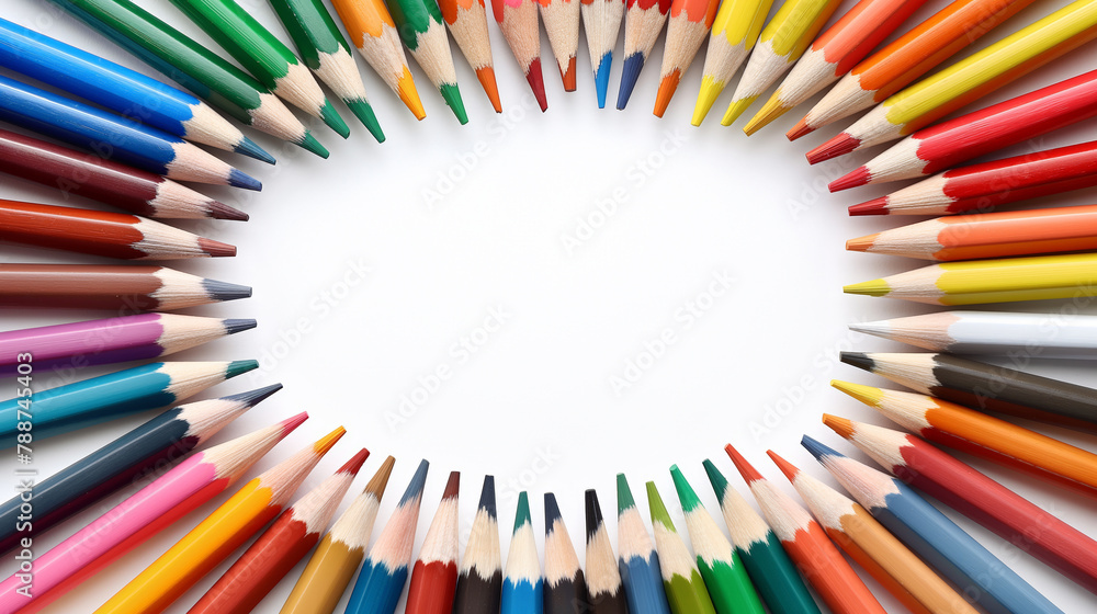 A circle of colorful sharpened pencils with tips pointing inward, creating a ring around a white central space on a white background. Copy space.