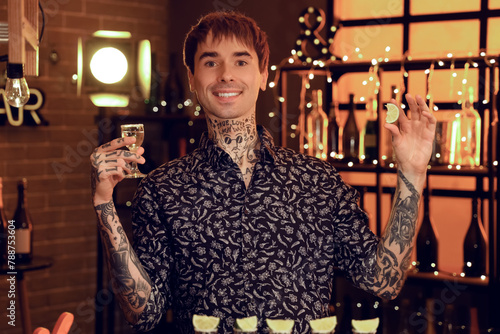Young tattooed man with teq...