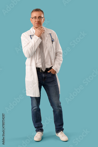 Mature doctor in medical go...