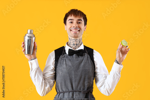 Smiling bartender holding c...
