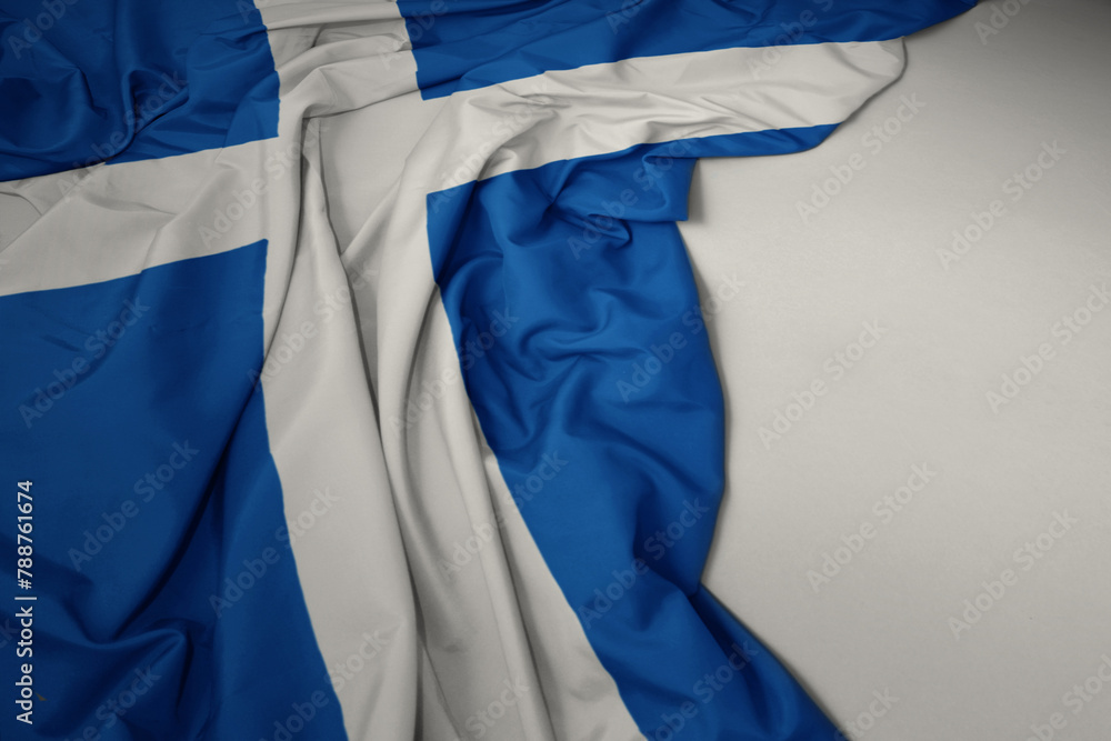 waving national flag of scotland on a gray background.