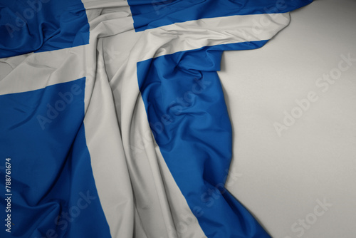 waving national flag of scotland on a gray background. photo