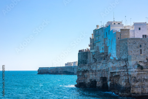 Polignano a Mare beachfront at old town. Beautiful coastal town in Apulia is being attracted to many tourists which are seen on platforms in the city. © Anze