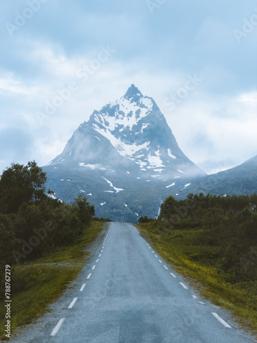 Empty road to mountains landscape in Norway scandinavian nature beautiful travel destination moody scenery
