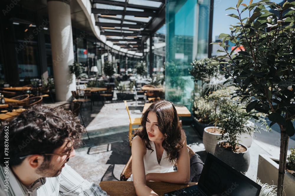 Fototapeta premium A multigenerational pair of business entrepreneurs engaging in a strategic meeting at a contemporary coffee bar, discussing growth and expansion plans.