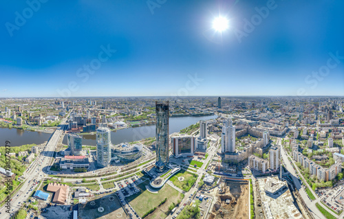 Yekaterinburg city with Buildings of Regional Government and Parliament, Dramatic Theatre, Iset Tower, Yeltsin Center, panoramic view at summer sunset.