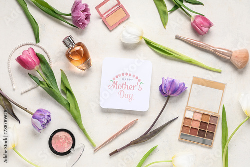Greeting card with text HAPPY MOTHER'S DAY, beautiful tulips, makeup cosmetic products and bottle of perfume on white background