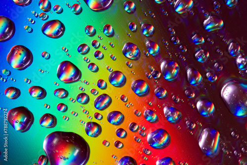 Colorful raindrops on a CD surface reflecting light photo
