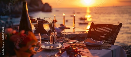 romantic table on the beach at sunset