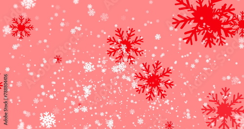 Red snowflakes of different sizes are falling on pink background