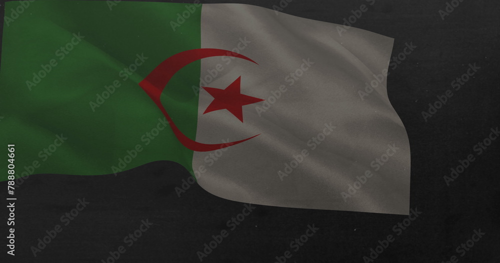 Fototapeta premium A flag with green and white sections and red crescent and star is waving