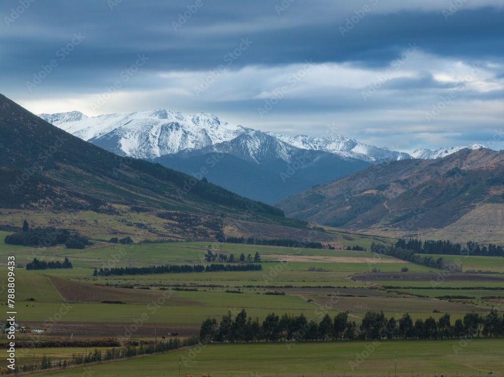 Aerial: View of the Southern Alps and farmland from Mossburn, Southland, New Zealand.