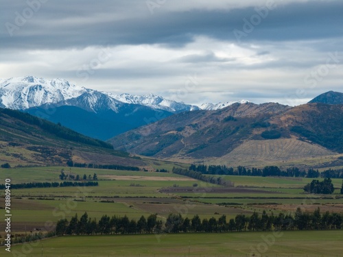 Aerial: View of the Southern Alps and farmland from Mossburn, Southland, New Zealand.