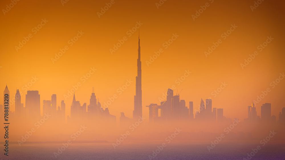 Dubai, United Arab Emirates - Jan 12 2024, 4k, Panoramic view of downtown Dubai skyscrapers, with Burj Khalifa in the middle, at dawn in a haze, a view from the sea, Dubai, United Arab Emirates Dubai, United Arab Emirates - Jan 12 2024, 4k, Panoramic view of downtown Dubai skyscrapers, with Burj Khalifa in the middle, at dawn in a haze, a view from the sea, Dubai, United Arab Emirates